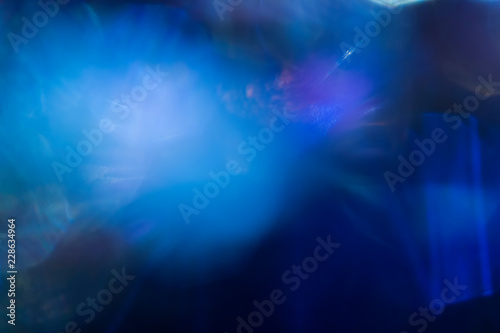 Smooth blue spots of light on blurred background