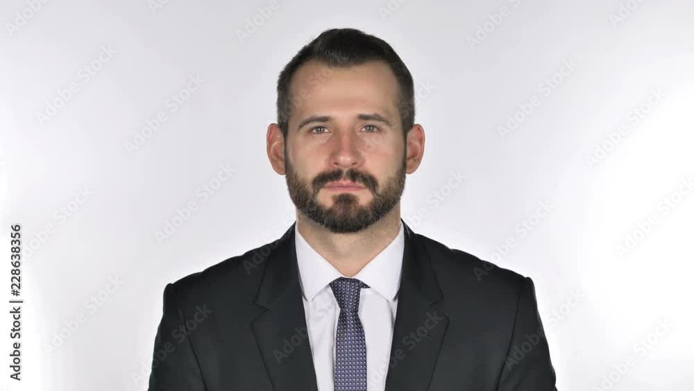 Serious Beard Businessman Looking at Camera, White Background Serious Beard Businessman Looking at Camera, White Background