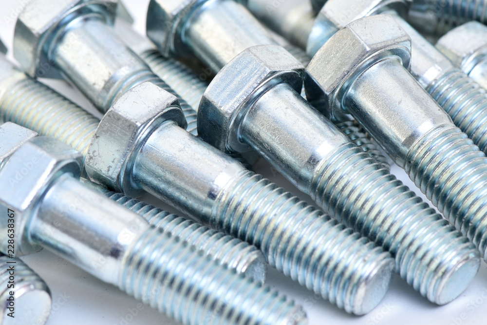 Fasteners on a white background. Manufacture of metal products. Fasteners on a white background. Manufacture of metal products.