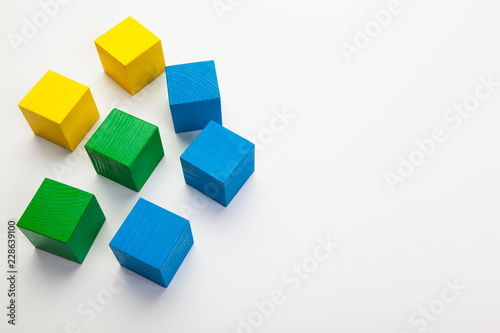 Colorful wooden building blocks isolated on white background