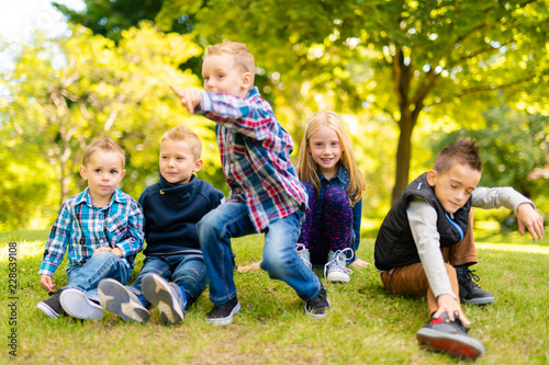 A group of children in spring field having fun