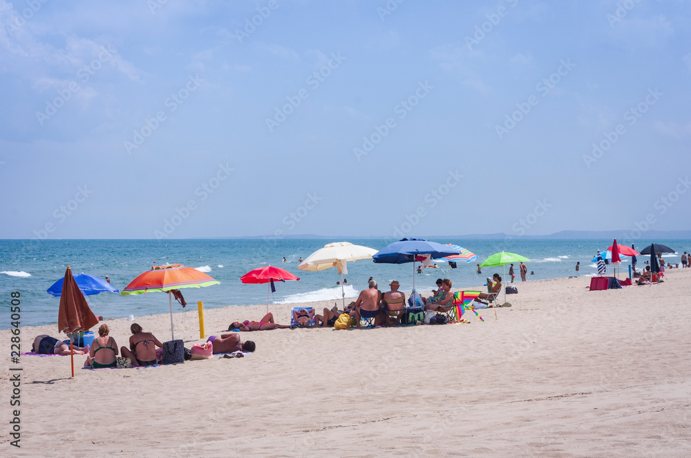 Catania, Sicily, Italy – august 15, 2018: people relax on the beach Lido azzurro