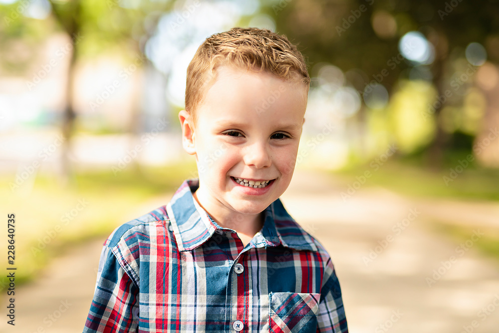 An nice adorable boy portrait outside standing An nice adorable boy portrait outside standing