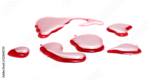 Red wine puddle, droplets isolated on white background