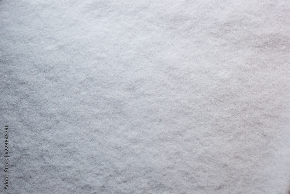 Fototapeta premium Texture of fresh snow covering ground thickly on frosty winte