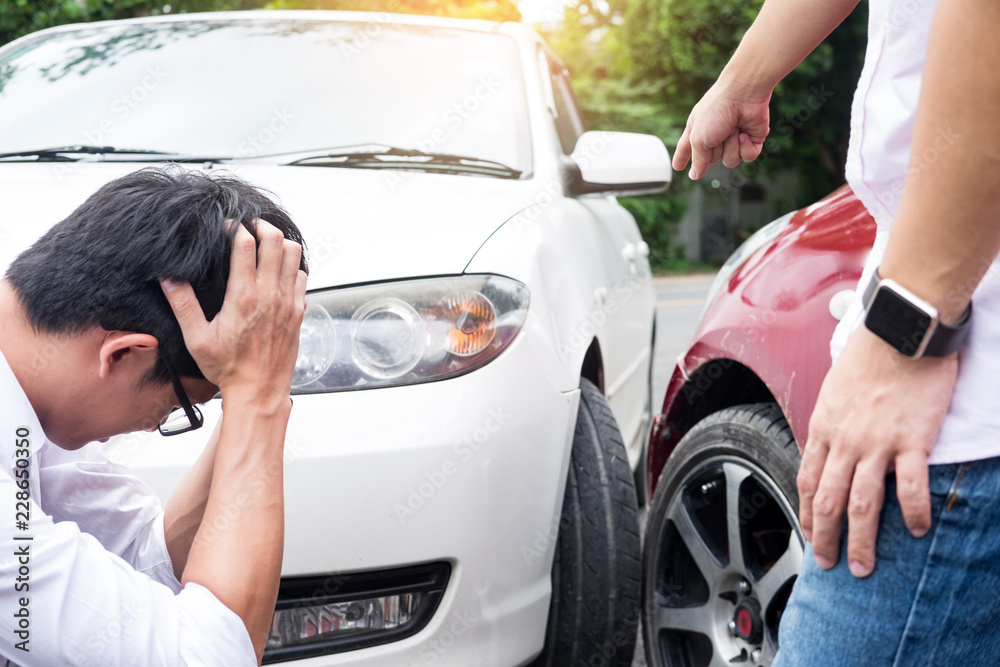 Two men arguing after a car accident Traffic Collision on the road. Two men arguing after a car accident Traffic Collision on the road.