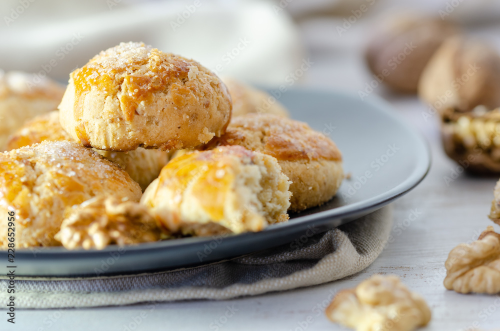 Shortcake of walnut on a wooden background. Shortcake of walnut on a wooden background.