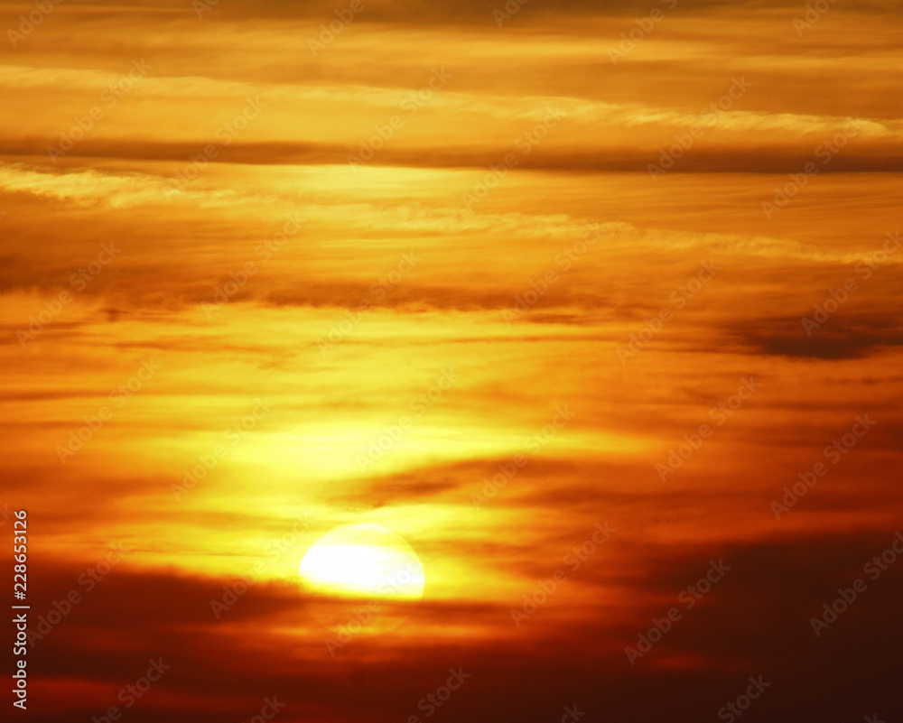 sun in the clouds in the sunset sun in the clouds in the sunset