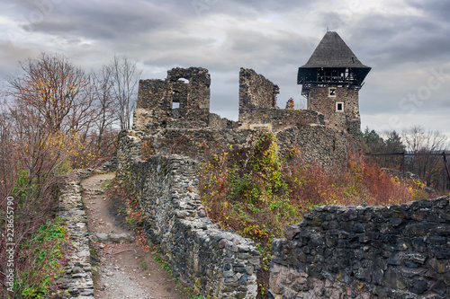 ruins of Nevytsky castle of TransCarpathia on a gloomy november day. popular tourist destination of Ukraine photo