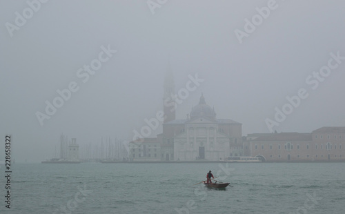 Grand Canal at a foggy evening. Venice - Italy