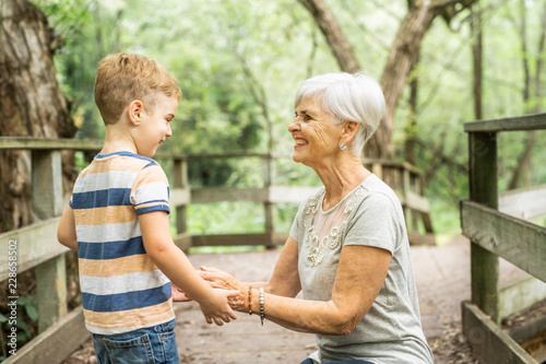 Grandmother and grandson spend the weekend in the park