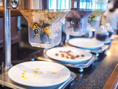 Quadro em tela Cornflake or​ cereal​ dispenser​ on​ the​ counter​ bar​ in​ restaurant for those who stay in the hotel, take them for a buffet breakfast