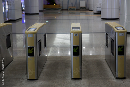Ticket barriers at subway entrance, transpotation symbols of developed and technology..