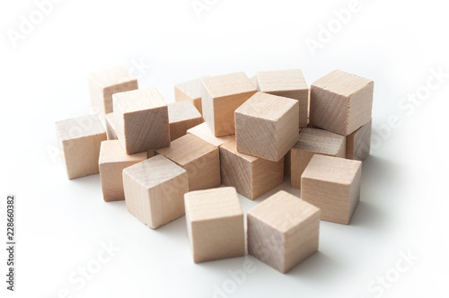 closeup of  piece of wooden brick of construction game on white background