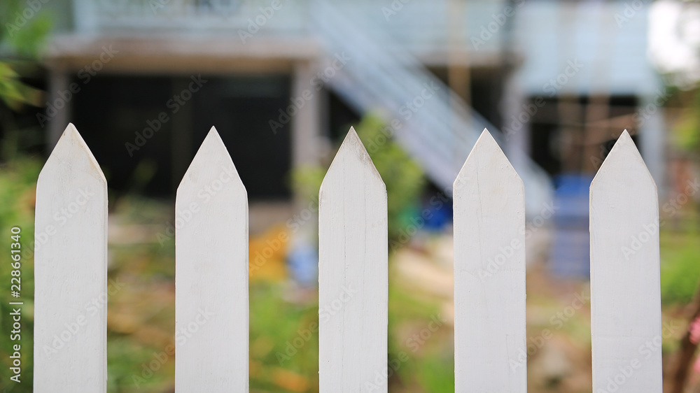 Close-up white sharp wooden fence. Close-up white sharp wooden fence.