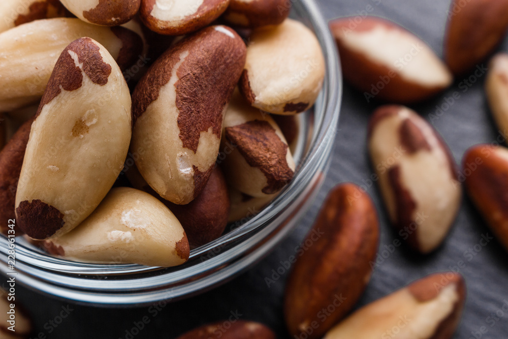 brazil nut on a dark stone background brazil nut on a dark stone background