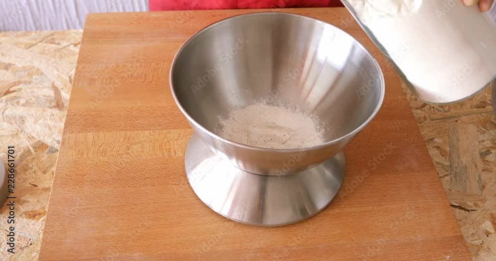 Home cooking, making dough crust for pumpkin pie, wheat flour weighting using electric kitchen scale Home cooking, making dough crust for pumpkin pie, wheat flour weighting using electric kitchen scale