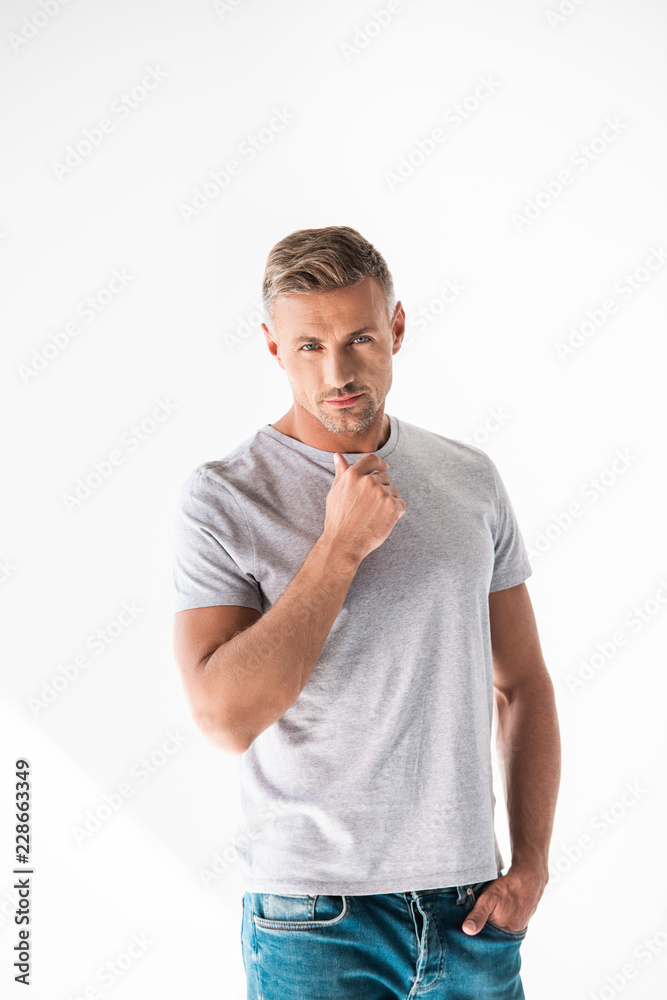 thoughtful adult man in blank grey t-shirt looking at camera isolated on white thoughtful adult man in blank grey t-shirt looking at camera isolated on white