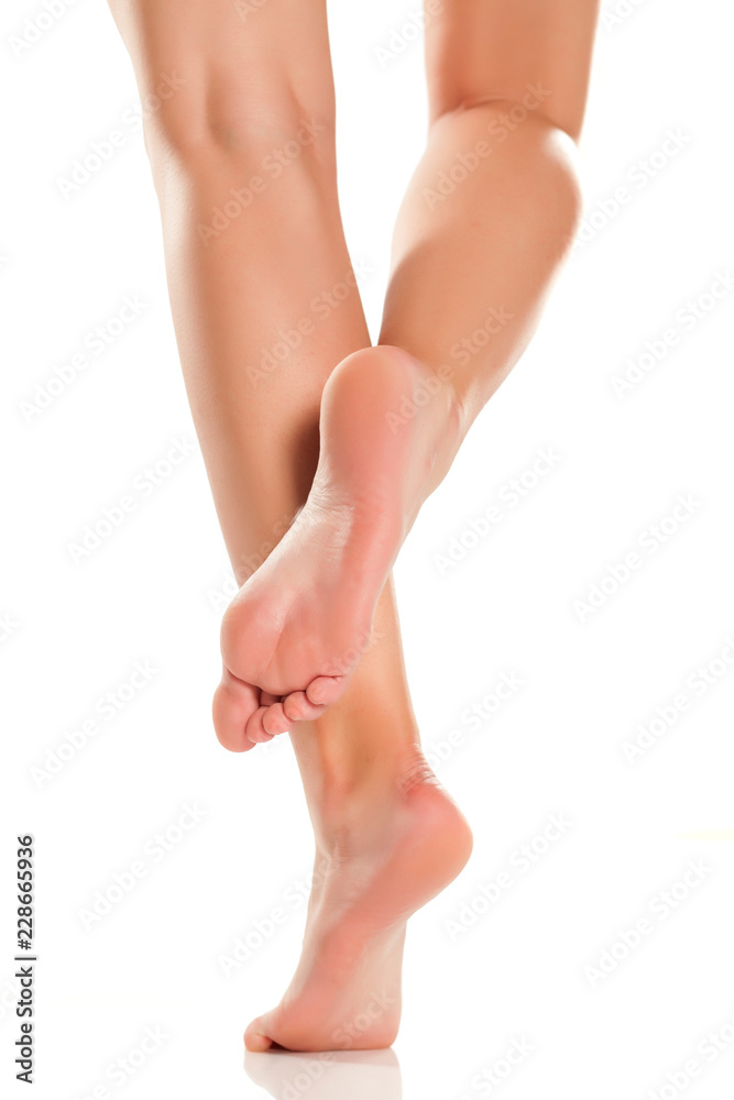 female bare feet on white background female bare feet on white background