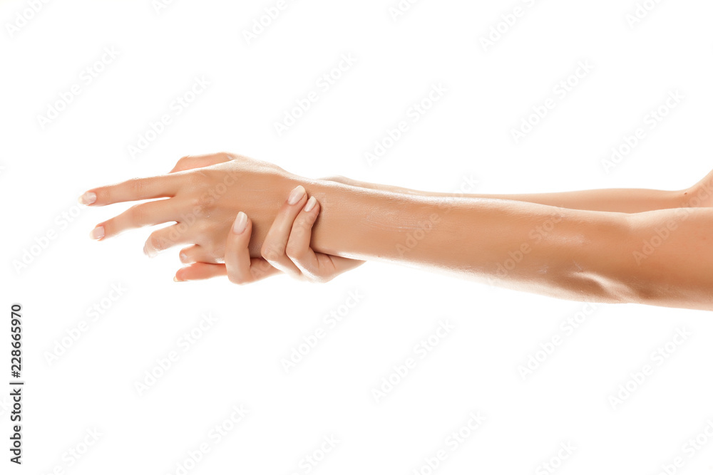 closeup of female hands applying hand cream on white background - obrazy, fototapety, plakaty 