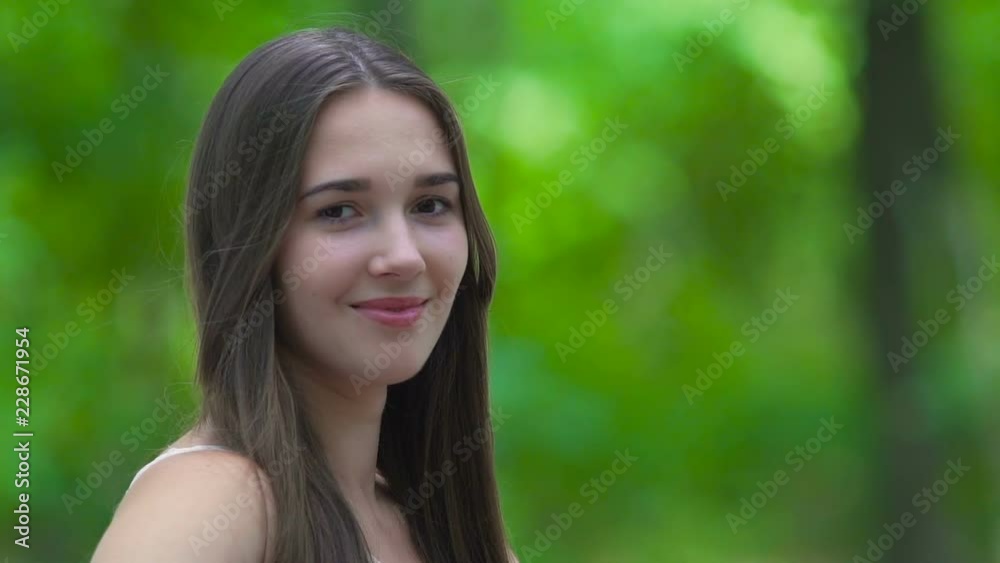 custom made wallpaper toronto digitalWoman in love smiles looks in camera in forest outdoors, female smile text place