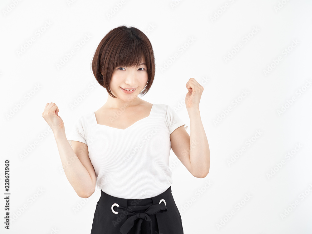 ガッツポーズで応援をする女性 ガッツポーズで応援をする女性