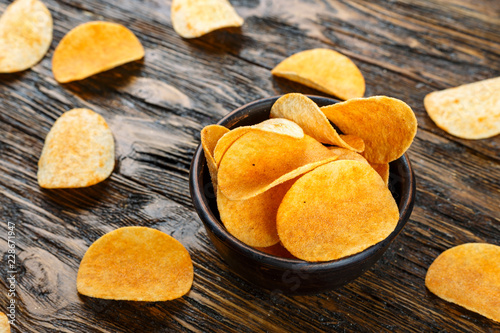 potato chips on wooden background