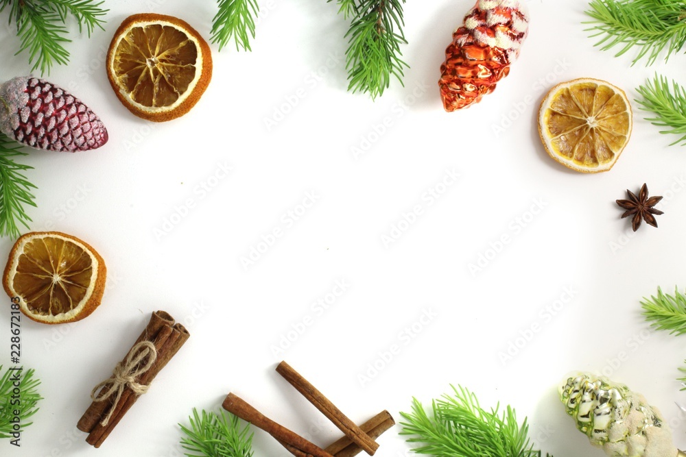 Christmas composition. Christmas frame of fir branches cinnamon, orange and anise. Christmas Wallpaper. Flat position, top view.