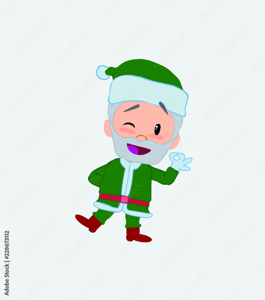 Green Santa Claus doing the OK sign with his hand. Green Santa Claus doing the OK sign with his hand.