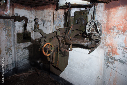 An abandoned bunker  an old military pillbox  an infantry weapon preserved after the war