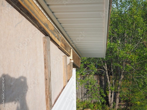 Construction of the frame house. Siding installation