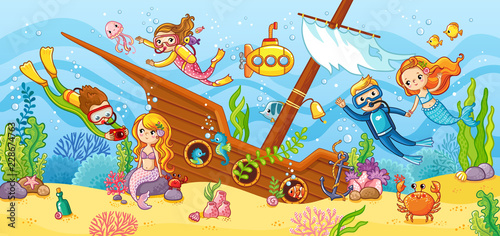 Children swim with scuba diving in the wreck