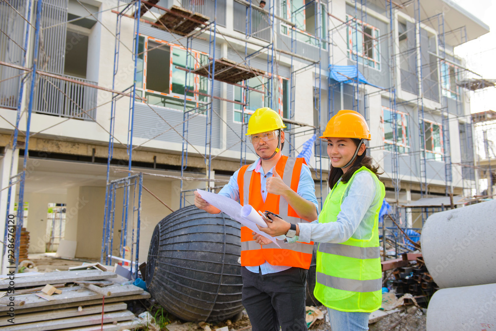 Two construction engineers working together Two construction engineers working together
