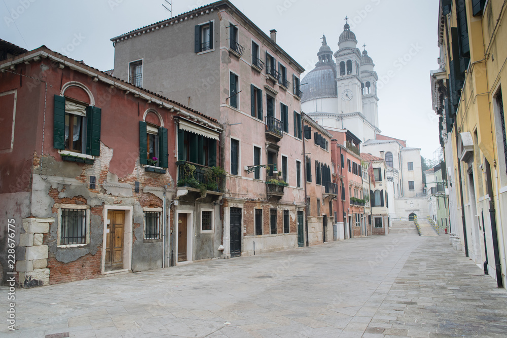 VENICE, ITALY, Empty street of old Venice on winter misty day, Venice, Ita