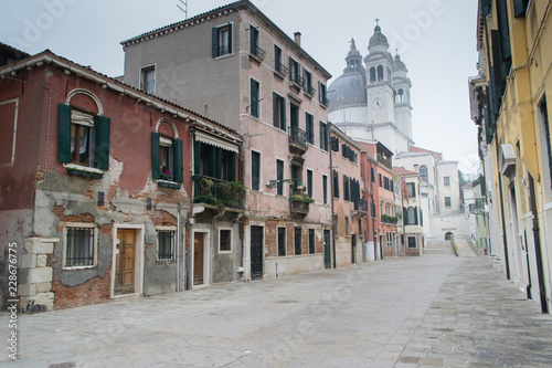 Fototapeta Naklejka Na Ścianę i Meble -  VENICE, ITALY, Empty street of old Venice on winter misty day, Venice, Ita