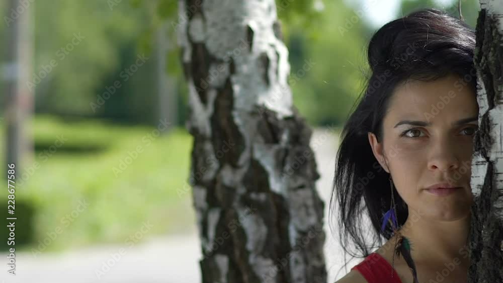 Attractive beautiful female outdoor portrait, dolly shot woman confident look Attractive beautiful female outdoor portrait, dolly shot woman confident look