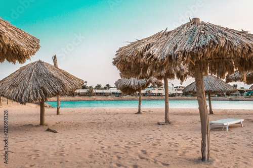 beach umbrellas made from natural materials by the sea