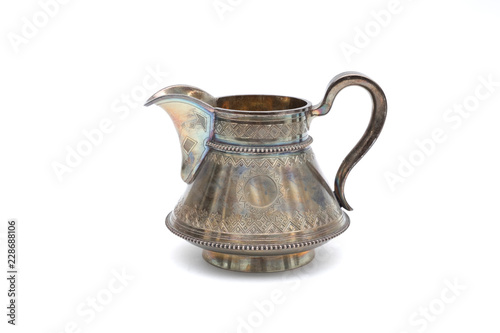 Vintage silver jug on white background. In isolation.