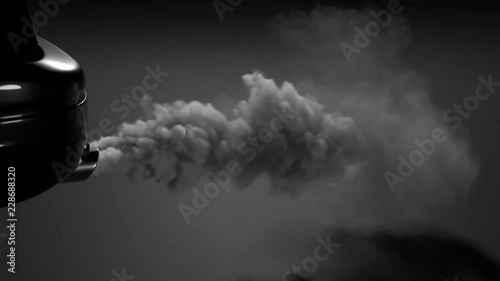 Fumes emmited from car exhaust dual pipe. White dense smoke on black background. photo