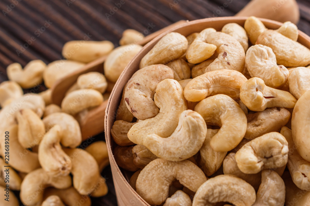 cashew nuts on a rustic wooden background