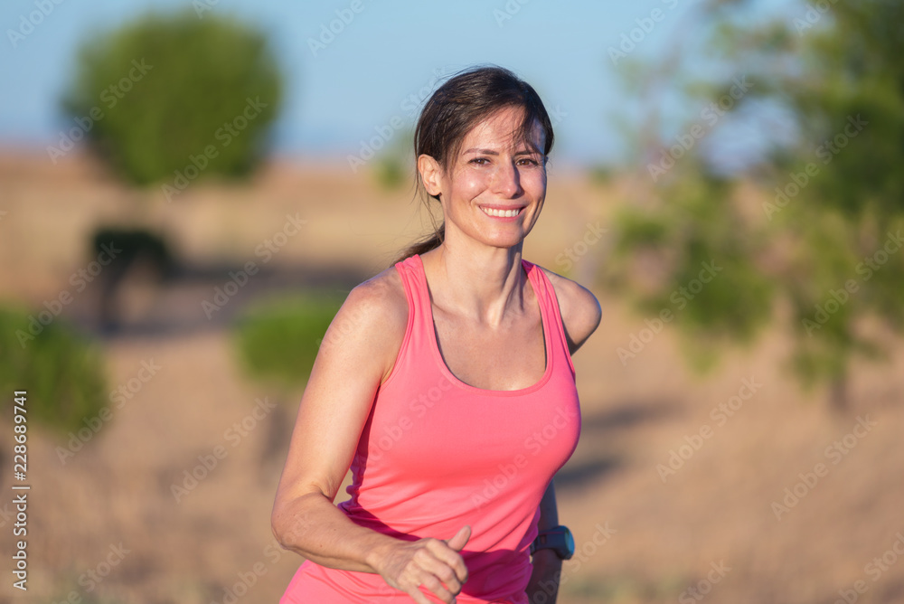 Fitness woman running in the park Fitness woman running in the park