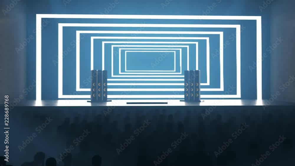 Silhouettes of a crowd of fans in front of empty stage or scene. Concert visuals