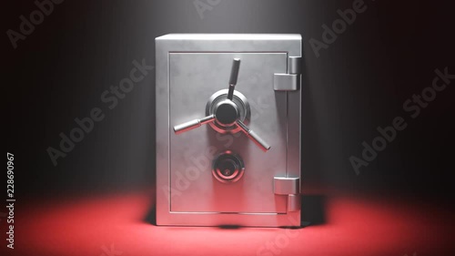 Empty steel safe on a red carpet in the spotlight.Vault doors are slowly opening photo