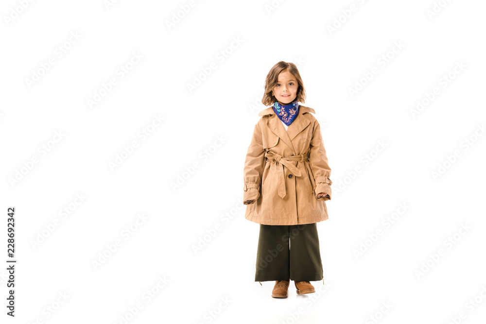 beautiful little child in trench coat standing and looking at camera isolated on white beautiful little child in trench coat standing and looking at camera isolated on white