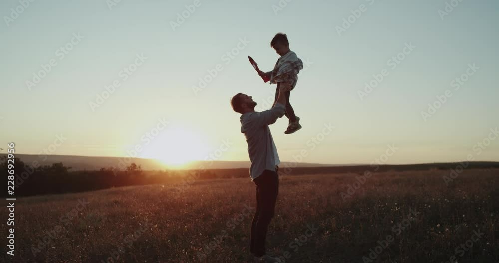 Perfect moments dad with his son , at sunset playing together with a airplane , boy dreaming will becoming a pilot. Perfect moments dad with his son , at sunset playing together with a airplane , boy dreaming will becoming a pilot.