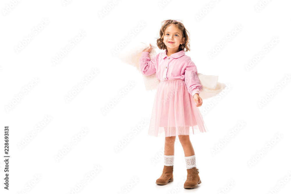 beautiful little child in pink clothes having fun isolated on white