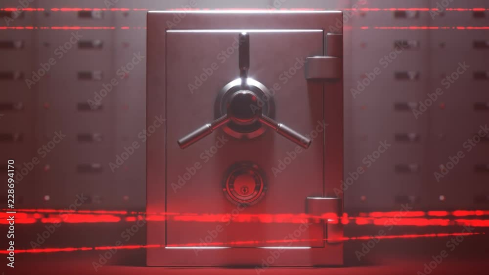 Steel safe and deposit boxes in secured room by red, moving laser system.