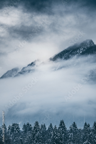 Cloudy landscape in Winter mountains