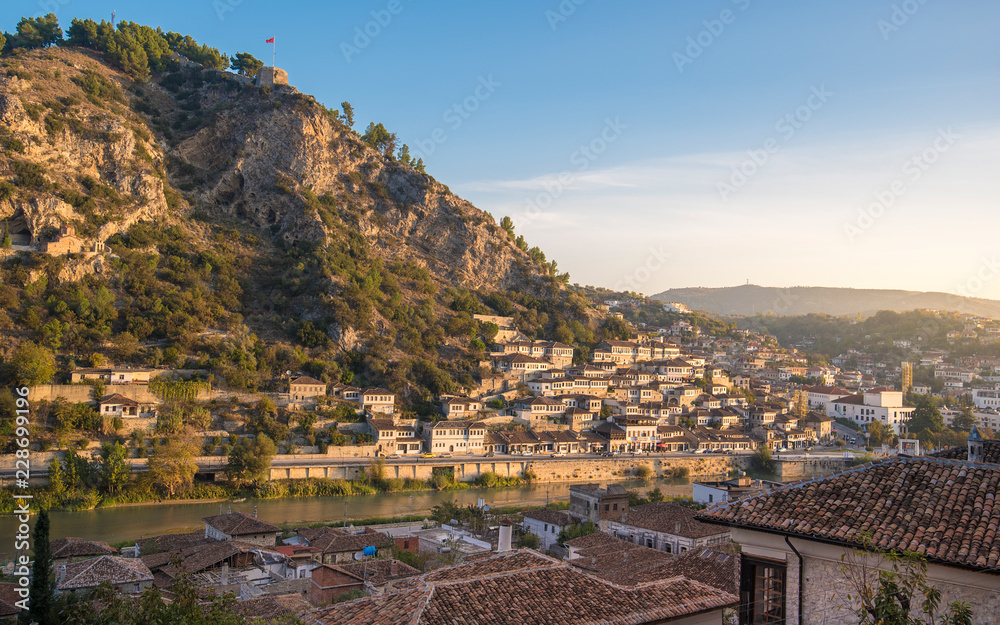 Panorama of historic city. Traditional ottoman houses in Berat old town (mangalem district) in Albania at sunrise. listed as UNESCO world heritage site, along with river Osum bank. thousand windows