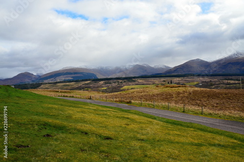 Scottish Highlands overlooking the countryside with green and white hills 